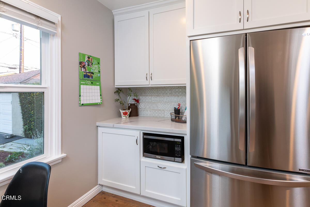 1404 Coolidge Avenue Pasadena, CA 91104 - Photo 14 of 33 a kitchen with cabinets and stainless steel appliances