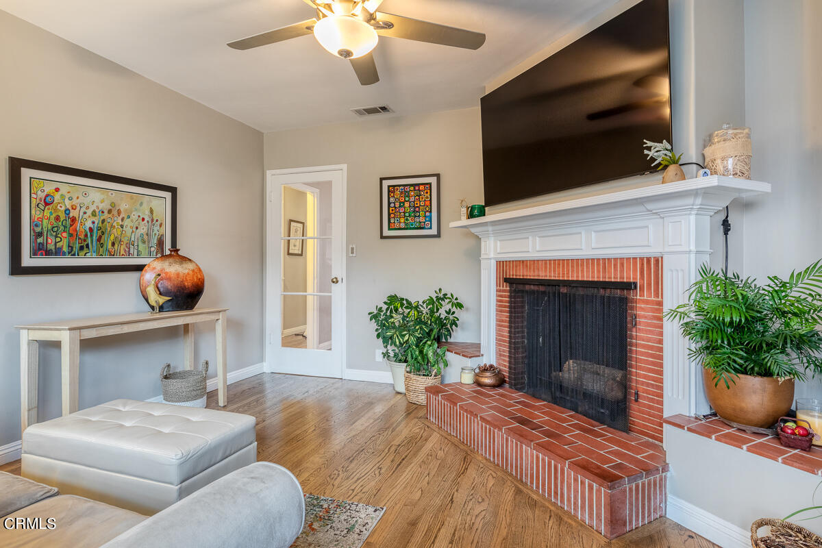 1404 Coolidge Avenue Pasadena, CA 91104 - Photo 18 of 33 a living room with furniture and a fireplace