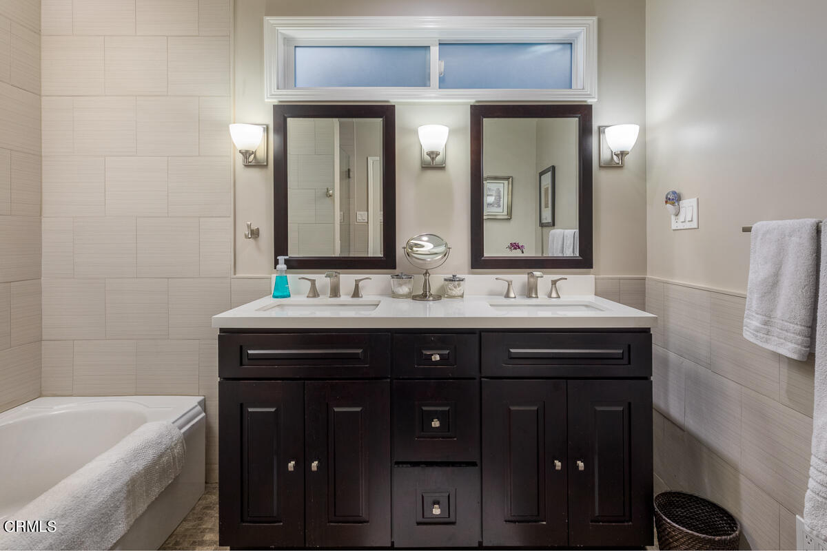 1404 Coolidge Avenue Pasadena, CA 91104 - Photo 22 of 33 a bathroom with a sink double vanity and a bathtub