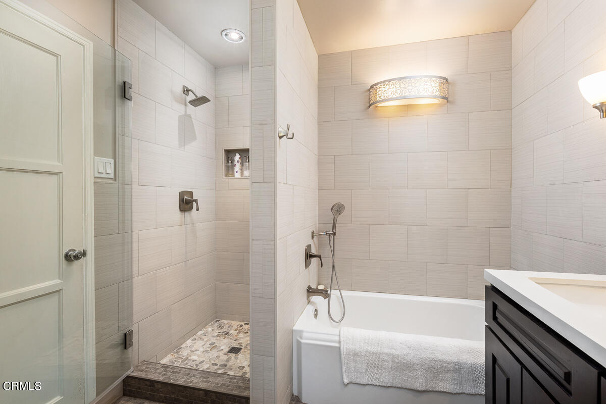 1404 Coolidge Avenue Pasadena, CA 91104 - Photo 23 of 33 a bathroom with a tub a sink and a shower