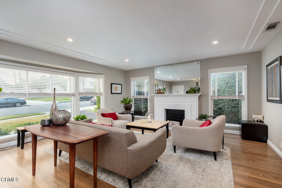 1404 Coolidge Avenue Pasadena, CA 91104 - Photo 3 of 33 a living room with furniture fireplace and a large window