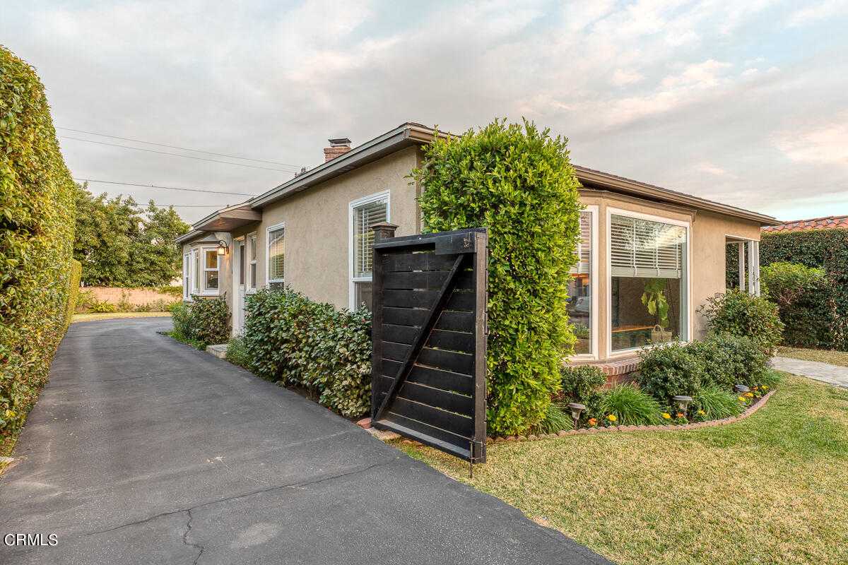 1404 Coolidge Avenue Pasadena, CA 91104 - Photo 32 of 33 a house with trees in front of it