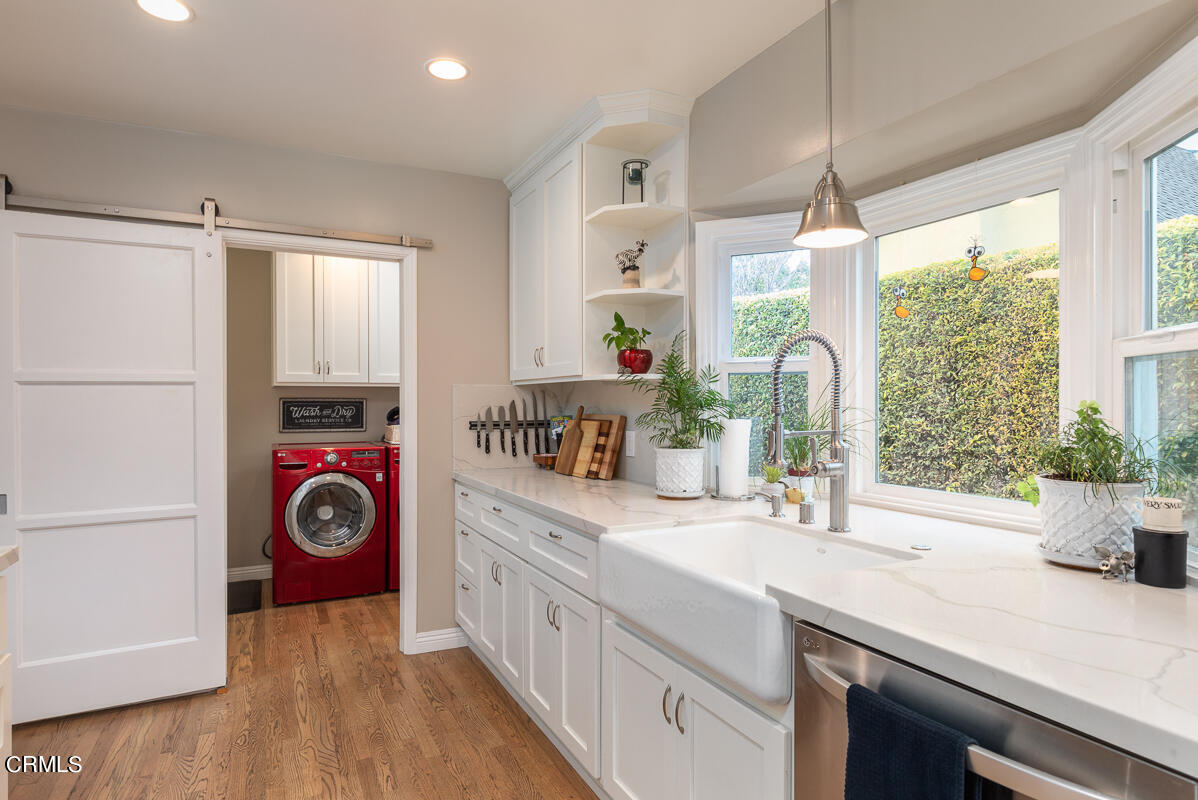 1404 Coolidge Avenue Pasadena, CA 91104 - Photo 10 of 33 a kitchen with stainless steel appliances a sink a counter space and a window