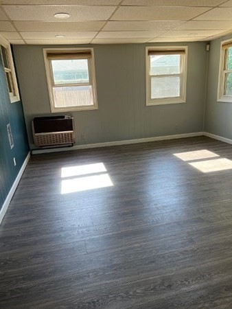 21 Don Court Pawtucket, RI 02861 - Photo 11 of 16 an empty room with wooden floor and windows