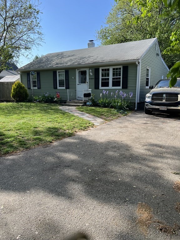 21 Don Court Pawtucket, RI 02861 - Photo 2 of 16 a front view of a house with a yard
