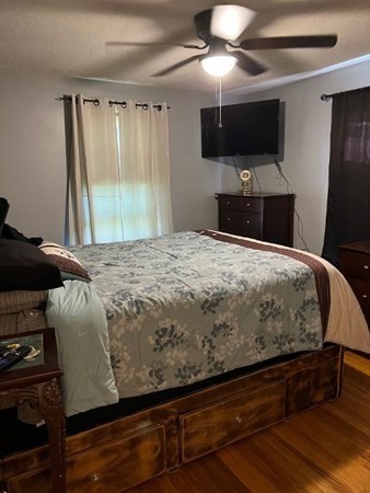 21 Don Court Pawtucket, RI 02861 - Photo 7 of 16 a bedroom with a bed and a flat screen tv