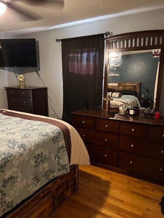 21 Don Court Pawtucket, RI 02861 - Photo 10 of 16 a bedroom with a bed and a flat screen tv