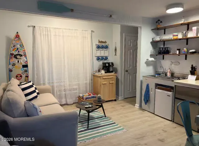 a living room with furniture and a area