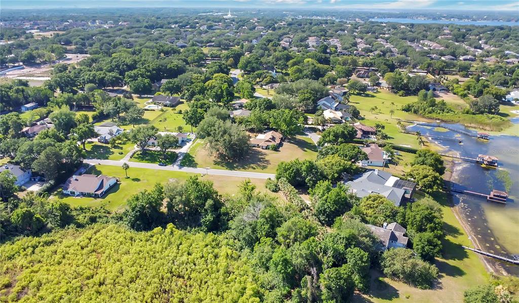 1661 Roberts Landing Road Windermere, FL 34786 - Photo 11 of 11 an aerial view of residential houses with outdoor space and trees