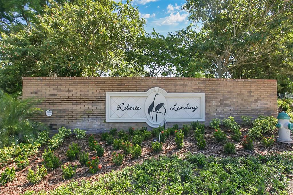 1661 Roberts Landing Road Windermere, FL 34786 - Photo 3 of 11 a sign that is on a wooden wall