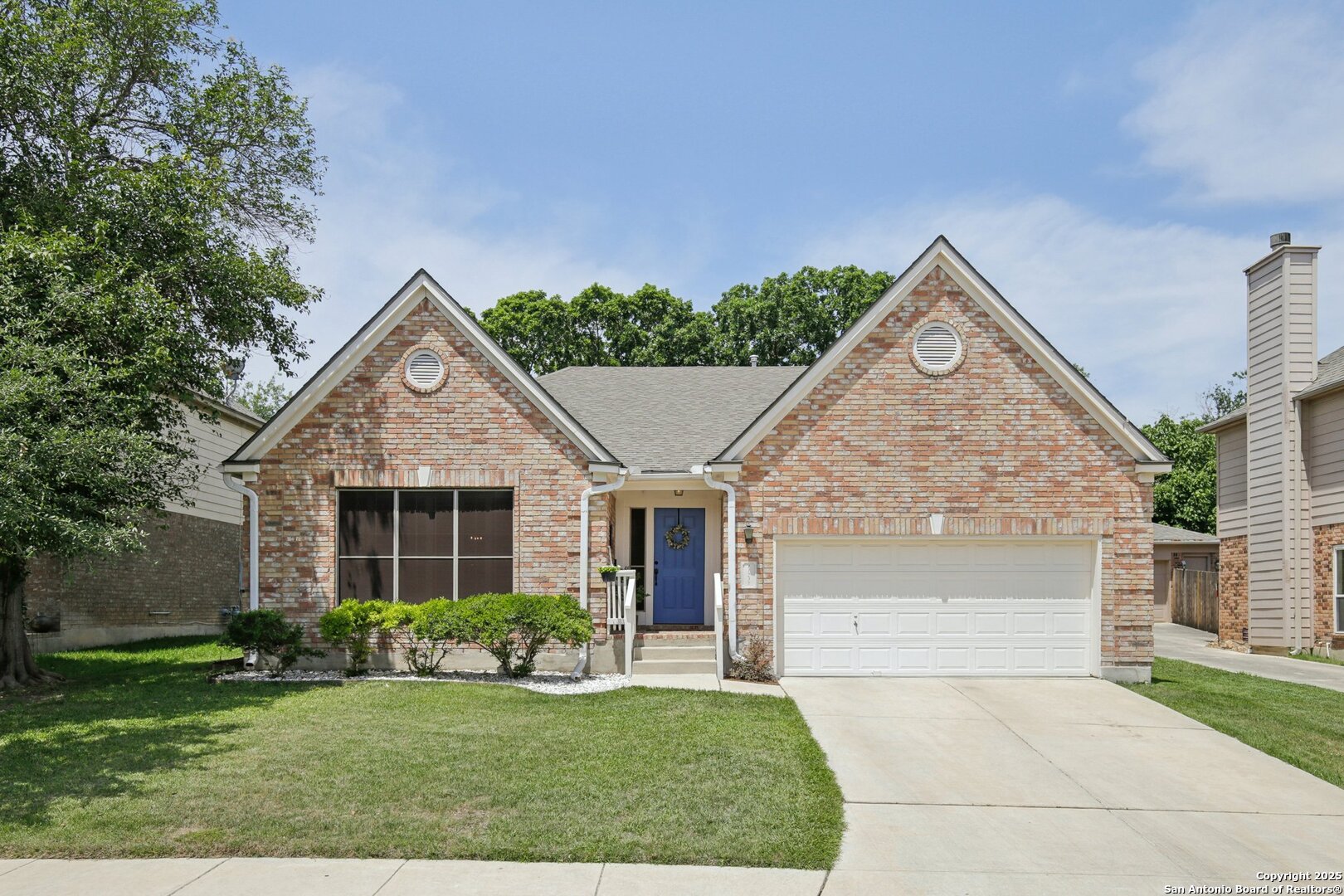 11239 Jade Spring San Antonio, TX 78249 - Photo 1 of 1 a front view of a house with a yard
