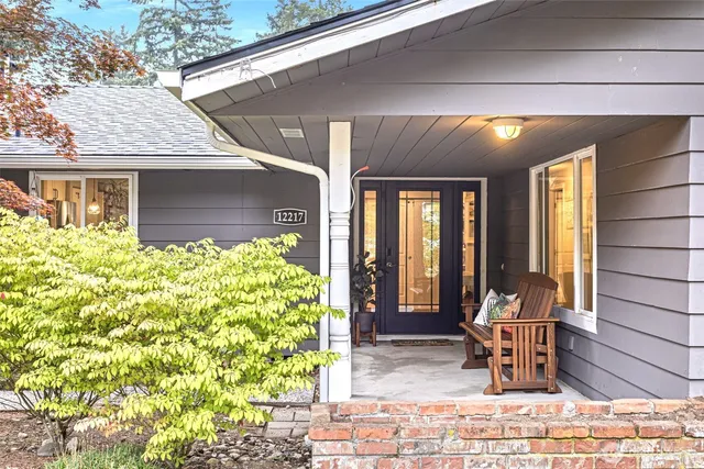 a front view of a house with outdoor seating