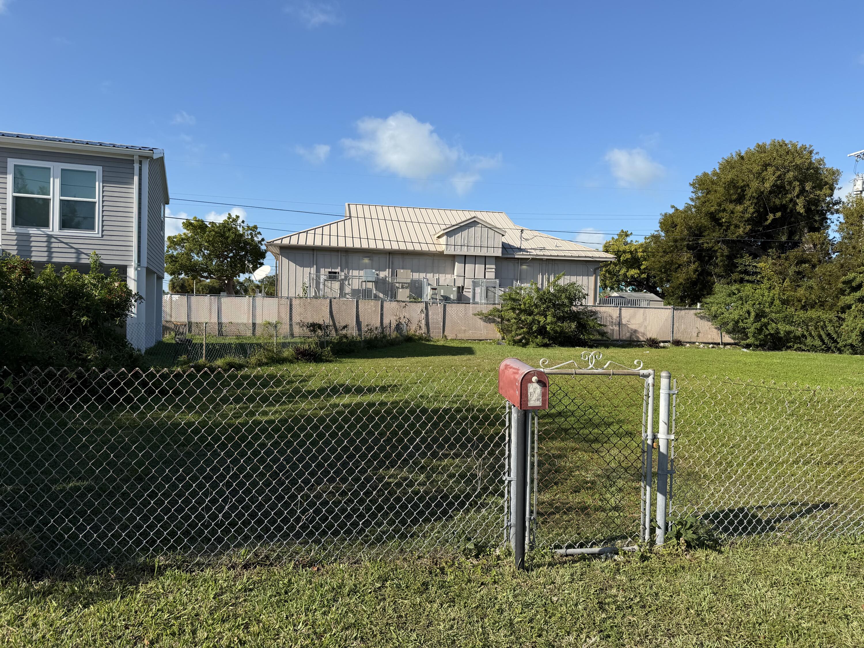 2 Dolphin Road Key West, FL 33040 - Photo 3 of 7 a front view of a house with a garden