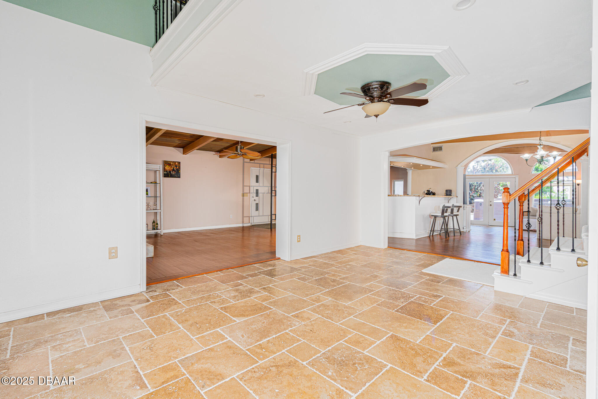 46 Oceanview Avenue Ponce Inlet, FL 32127 - Photo 2 of 79 a view of a hallway with a chandelier