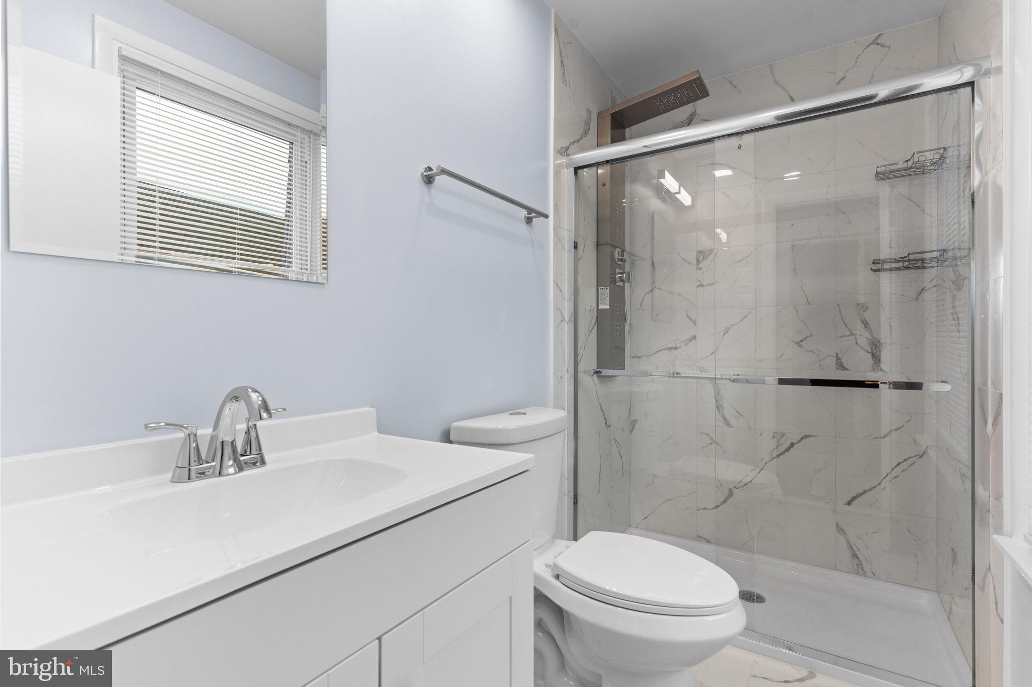 9823 Bonner Street Philadelphia, PA 19115 - Photo 19 of 29 a bathroom with a sink toilet and shower