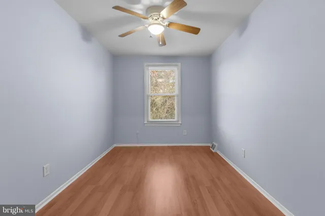 a view of a house with a door and wooden floor