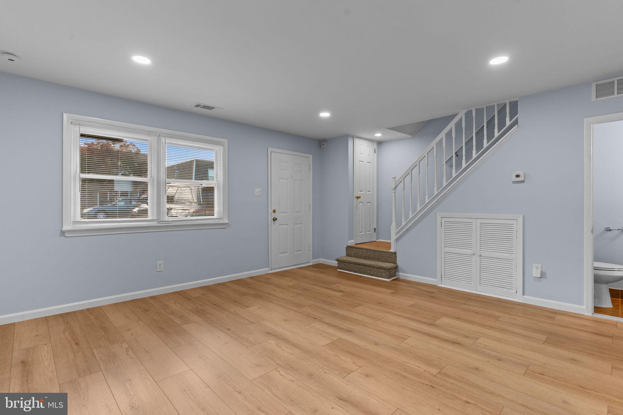 9823 Bonner Street Philadelphia, PA 19115 - Photo 4 of 29 a view of empty room with wooden floor and window