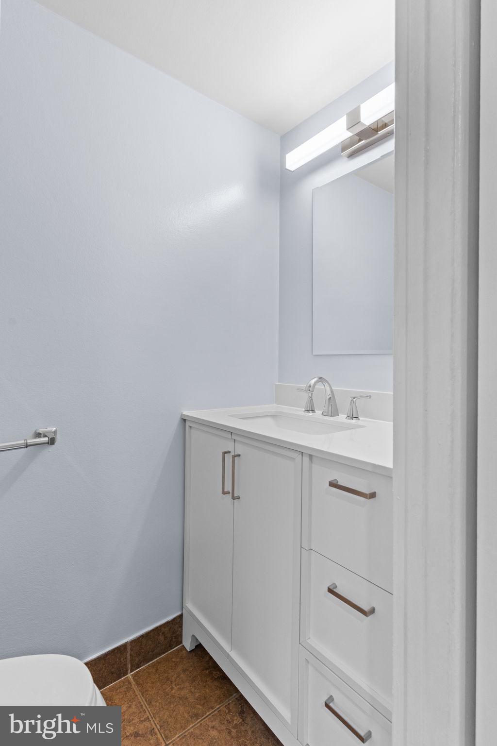 9823 Bonner Street Philadelphia, PA 19115 - Photo 7 of 29 a bathroom with a sink and a mirror