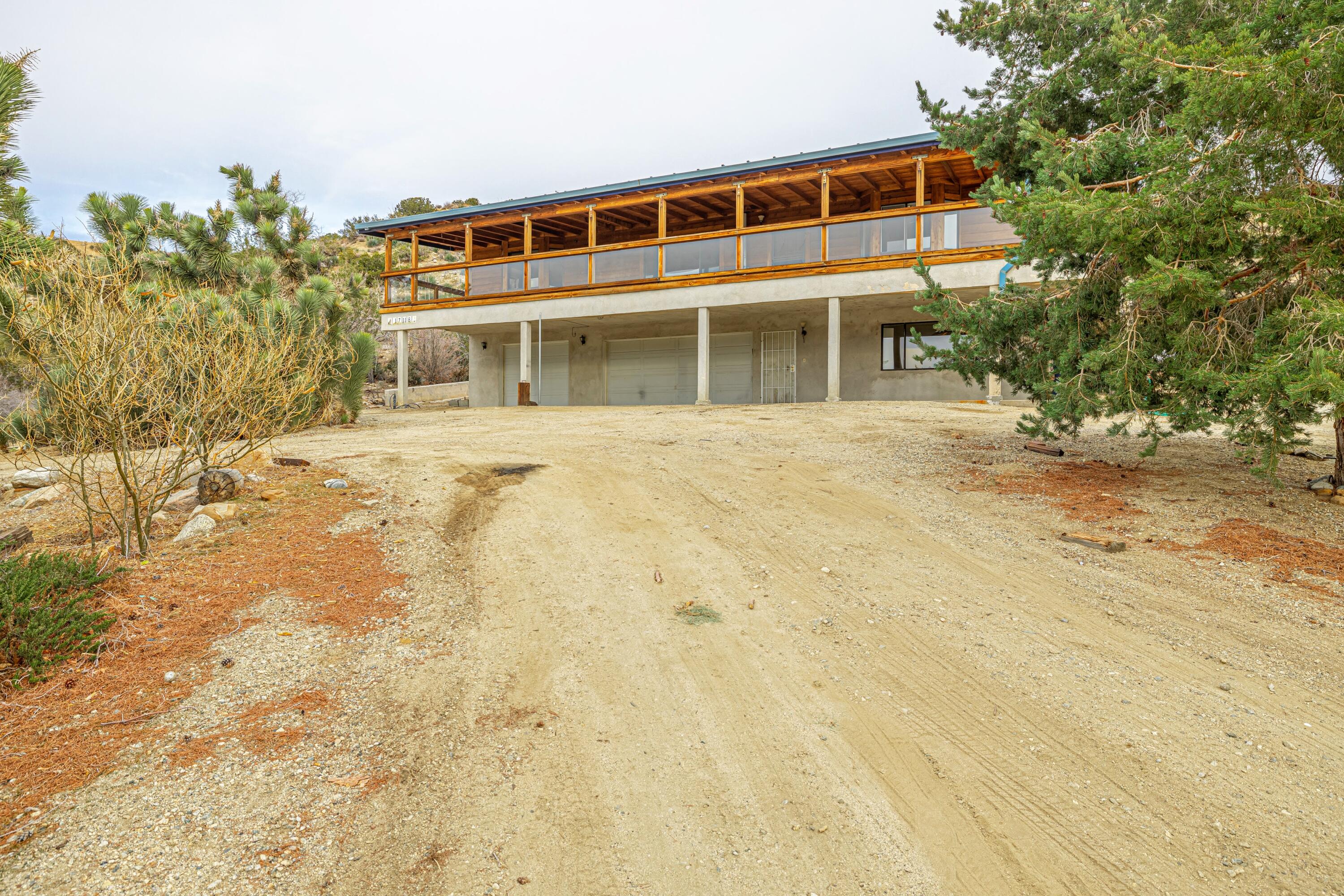 17118 Bob's Gap Road Valyermo, CA 93563 - Photo 55 of 55 a front view of a house with a yard