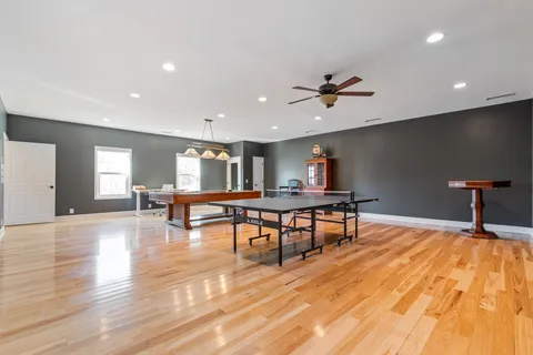 a front view of a house with a big yard