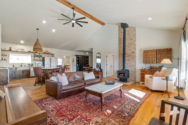 a living room with furniture and a table