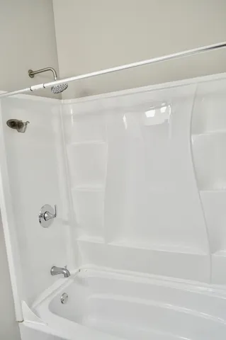 a view of a livingroom with wooden floor and a flat screen tv