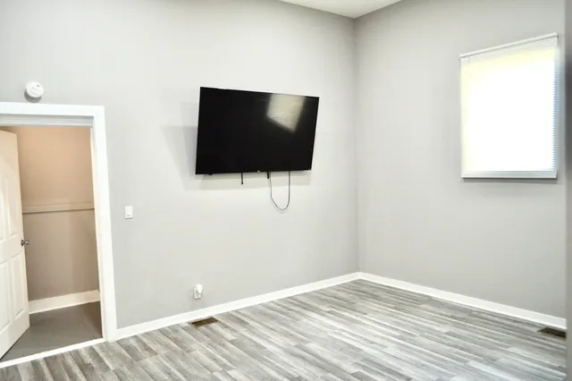 a view of a livingroom with wooden floor