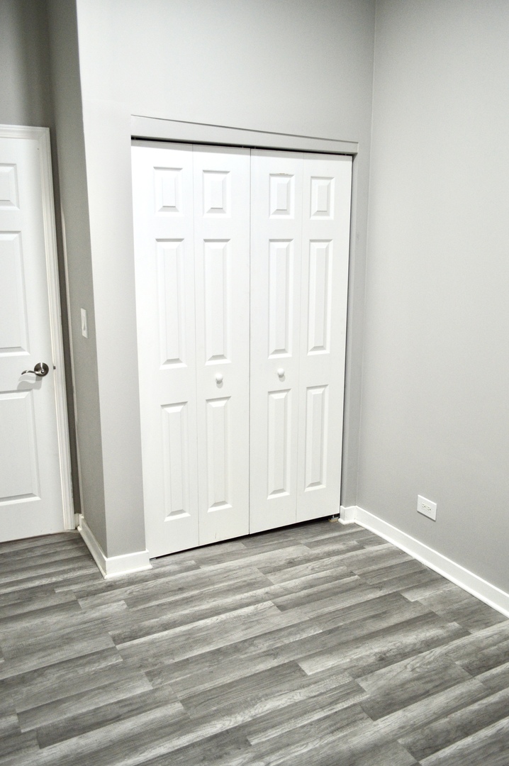 522 West 81st Street, Unit 1 Chicago, IL 60620 - Photo 8 of 9 a view of a livingroom with wooden floor