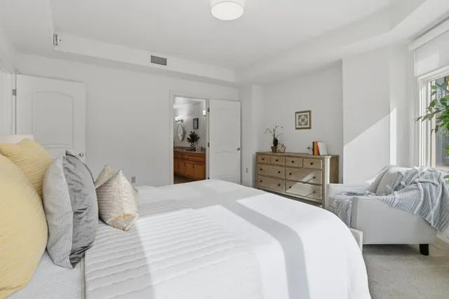 a bedroom with a bed and a couch