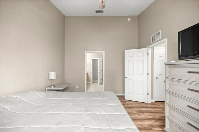 a view of a livingroom with wooden floor and cabinet