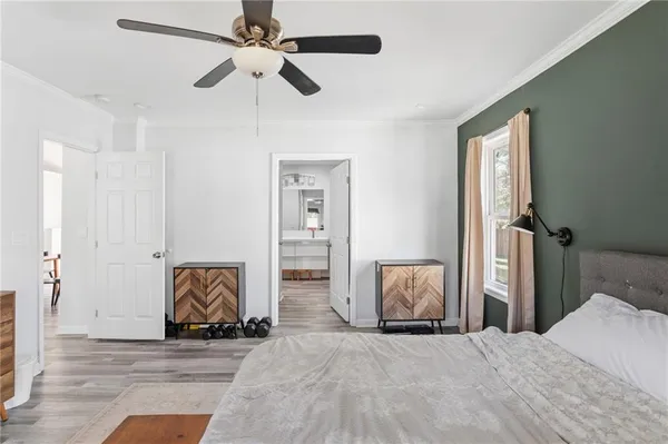 a bedroom with a bed and a dresser