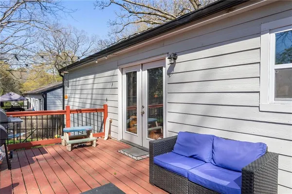 a backyard of a house with table and chairs