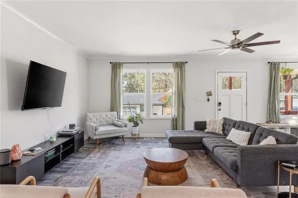 a living room with furniture and a flat screen tv