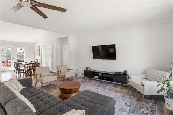 a living room with furniture and a flat screen tv