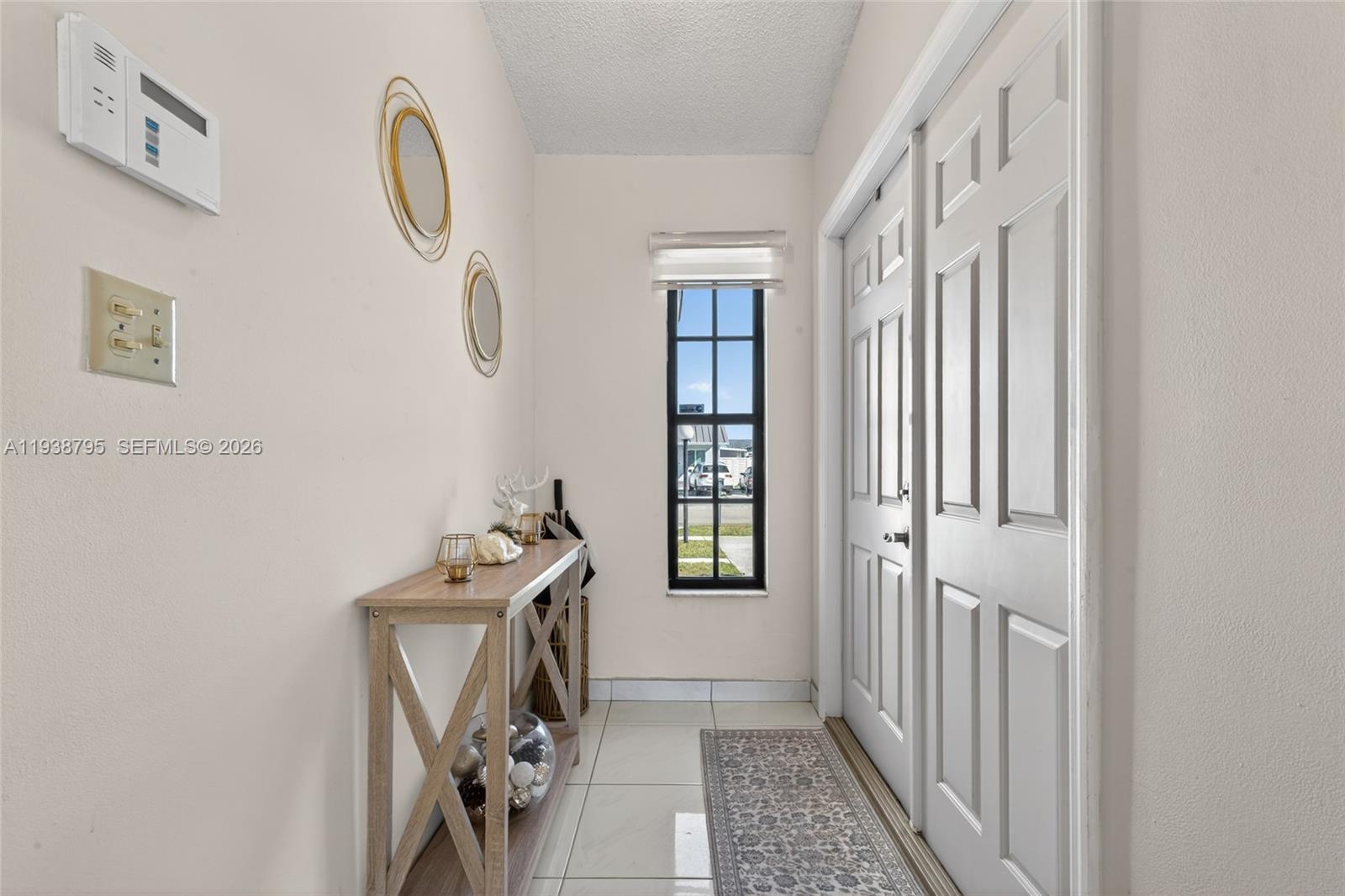 1136 Southwest 139th Place Miami, FL 33184 - Photo 12 of 42 a view of an entryway with wooden floor