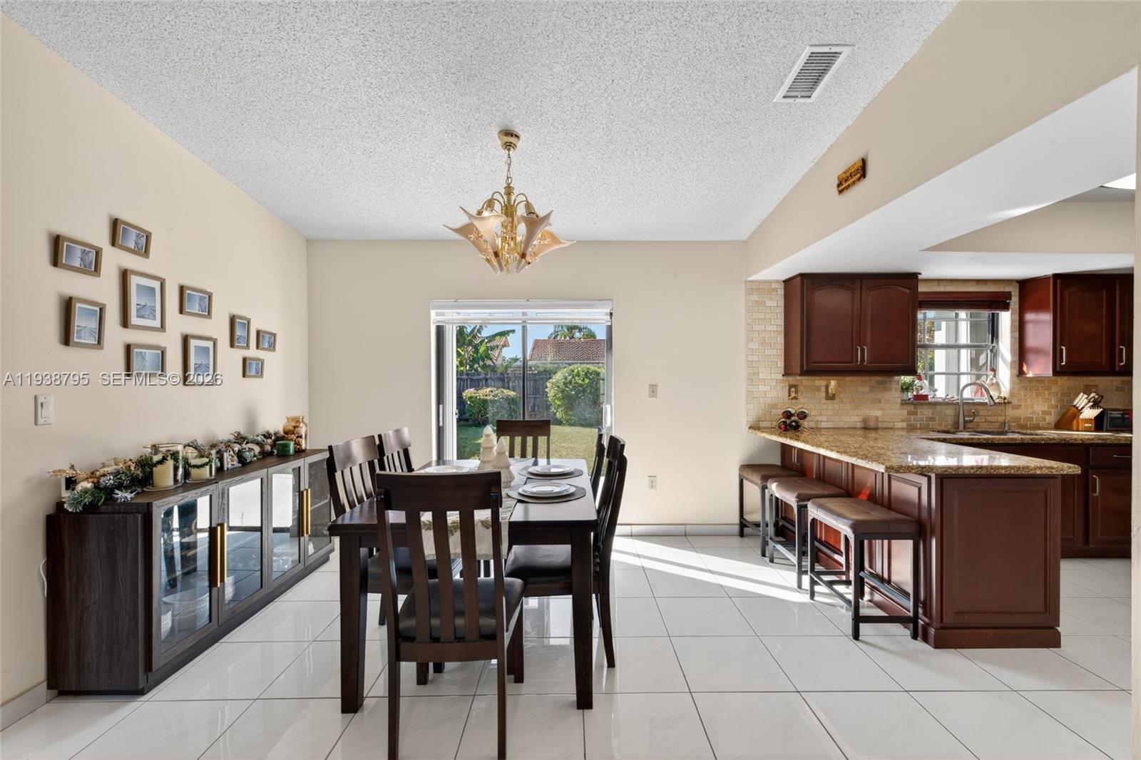 1136 Southwest 139th Place Miami, FL 33184 - Photo 20 of 42 a view of a dining room with furniture