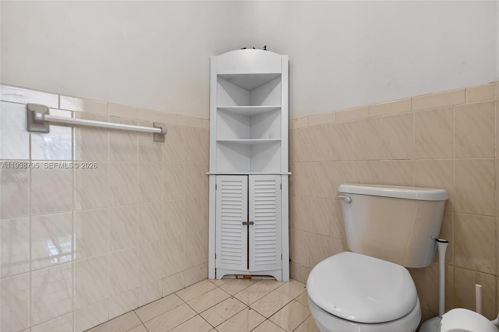 1136 Southwest 139th Place Miami, FL 33184 - Photo 31 of 42 a bathroom with a toilet and a sink