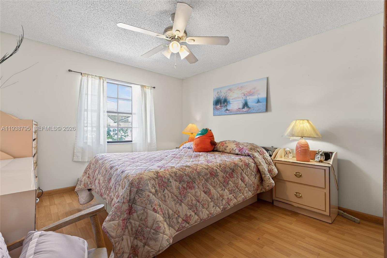 1136 Southwest 139th Place Miami, FL 33184 - Photo 34 of 42 a bedroom with a bed and wooden floor