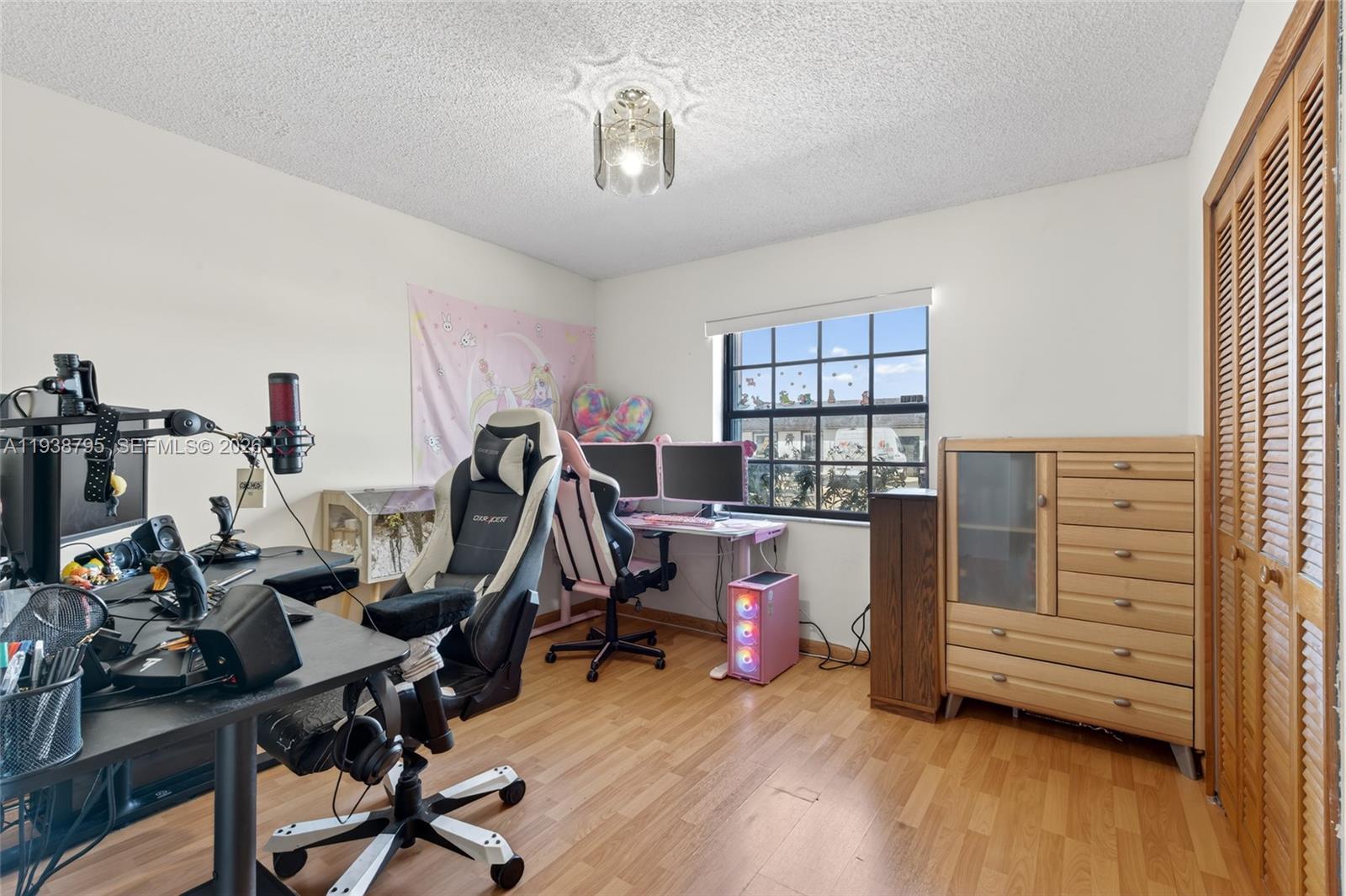 1136 Southwest 139th Place Miami, FL 33184 - Photo 35 of 42 a view of a workspace with furniture and a window
