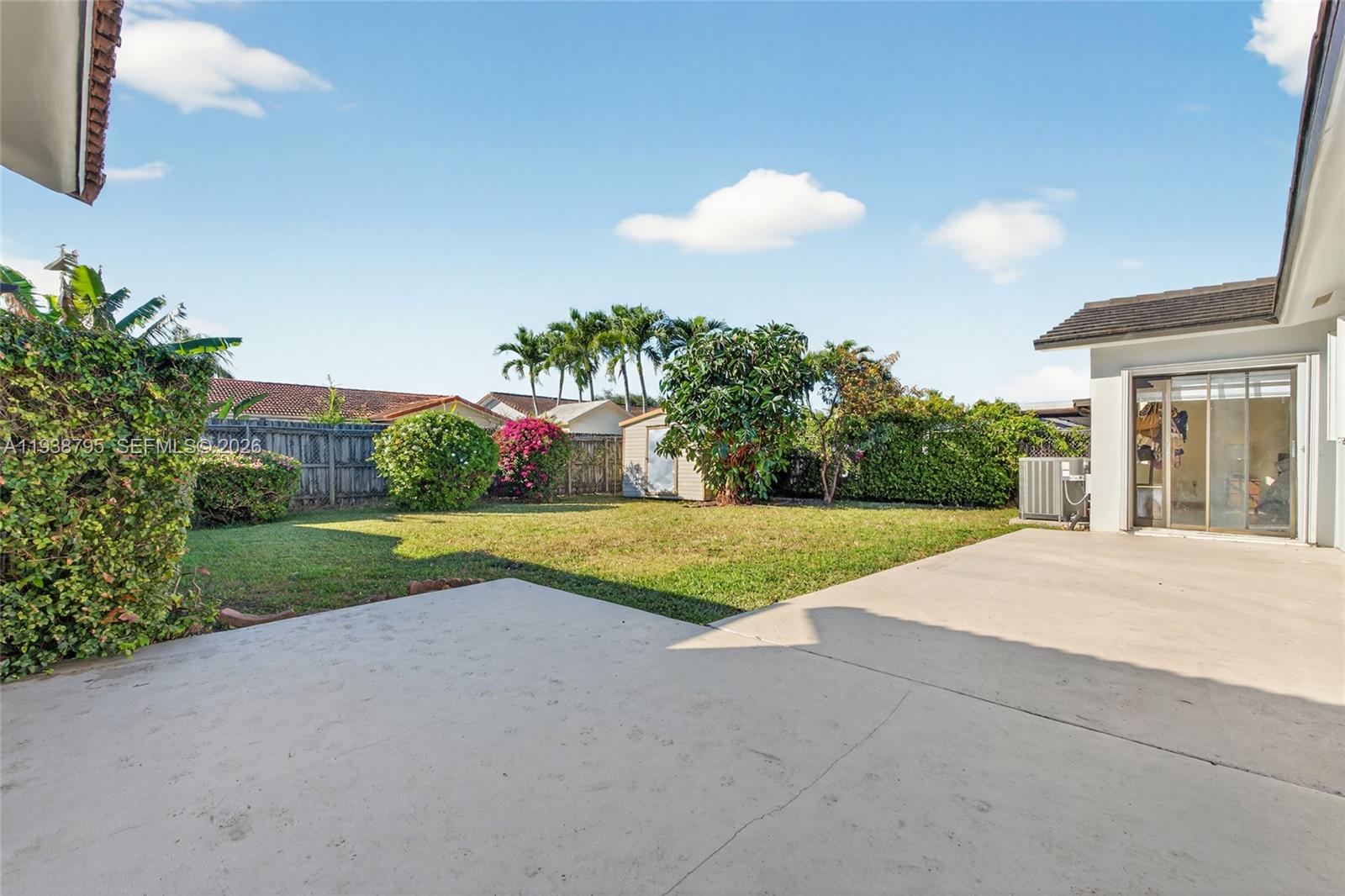 1136 Southwest 139th Place Miami, FL 33184 - Photo 39 of 42 a view of a house with porch and garden