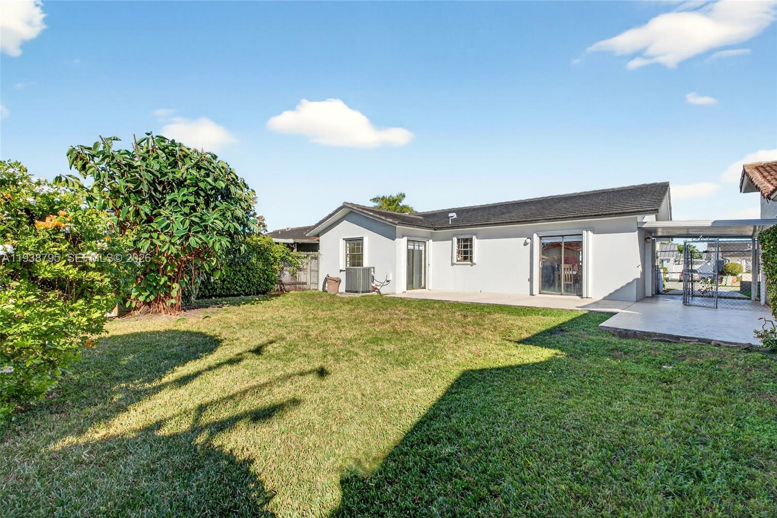 1136 Southwest 139th Place Miami, FL 33184 - Photo 40 of 42 a swimming pool with yard and outdoor seating