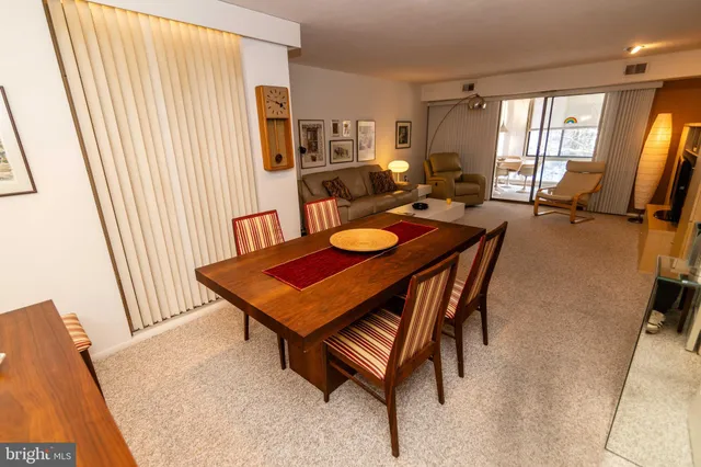 a kitchen with a sink cabinets and black appliances