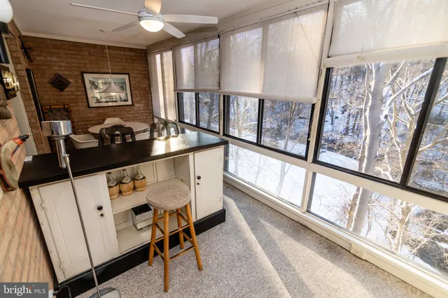a view of a livingroom with furniture and a table