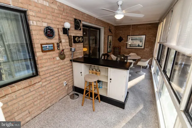 a view of a hallway with paintings on the wall