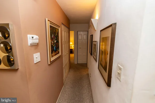 a bedroom with a bed and a lamp