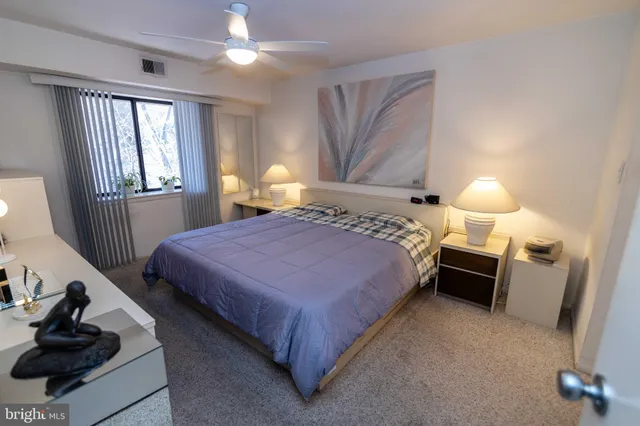 a bed room with a bed and a television