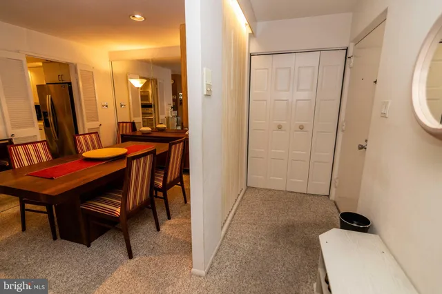 a living room with furniture gym equipment and a large window