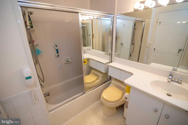a bathroom with a sink a mirror and a toilet