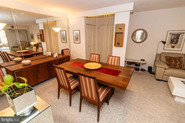 a view of a dining room with furniture and a table