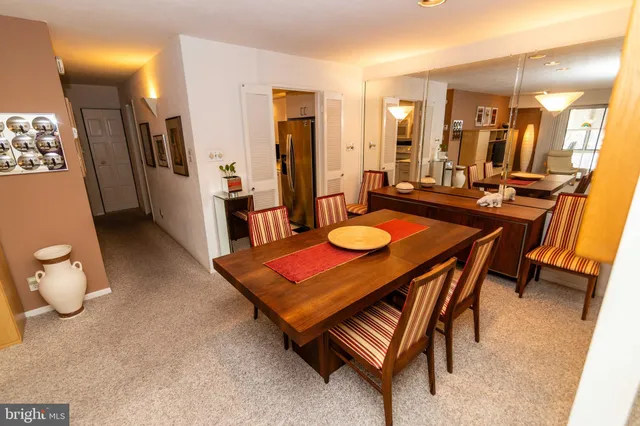 a very nice looking dining room with a table and chairs